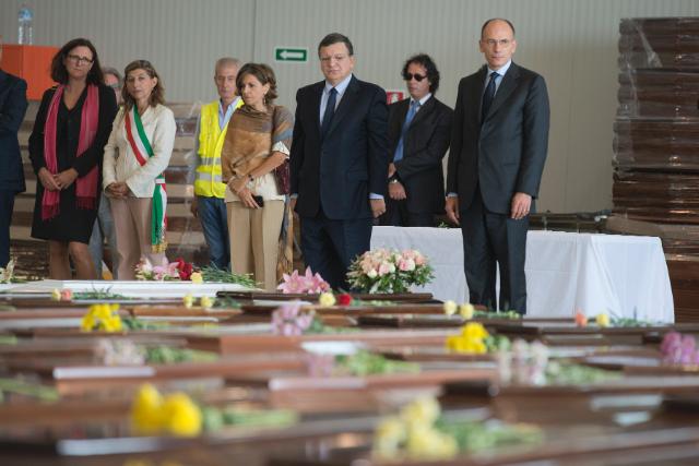 Enrico Letta, 1st, José Manuel Barroso, 2nd, Giusi Nicolini, 4th, and Cecilia Malmström, 5th, paying tribute to the victims, in front of their coffins (in the foreground, from right to left)